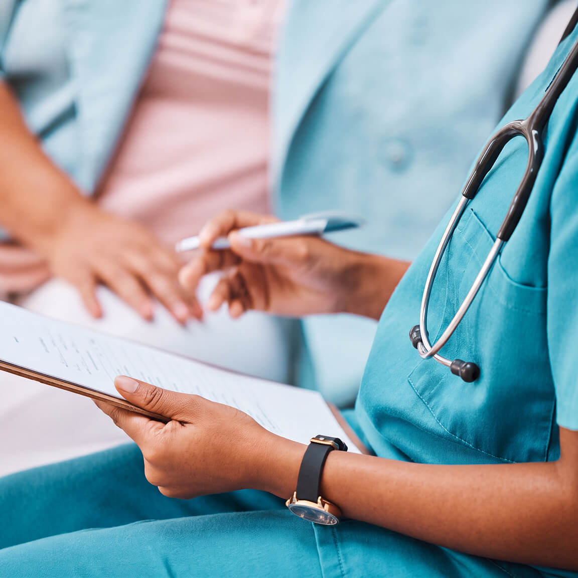 A physician consults with a patient before a CVAC System kidney stone treatment